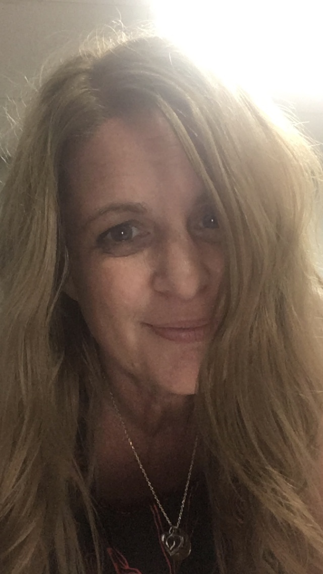 bonnie A woman with long blonde hair smiling for the camera.