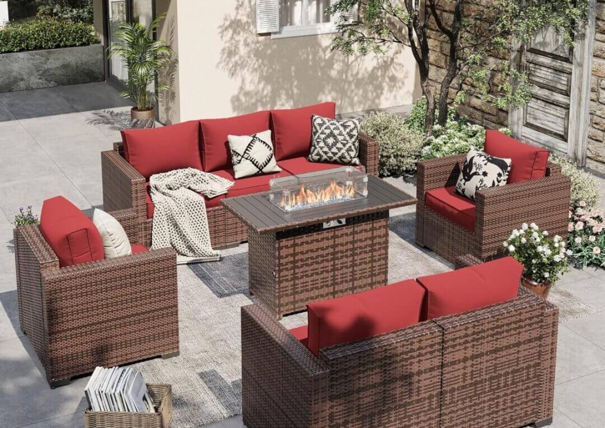 Outdoor patio set with red cushions.